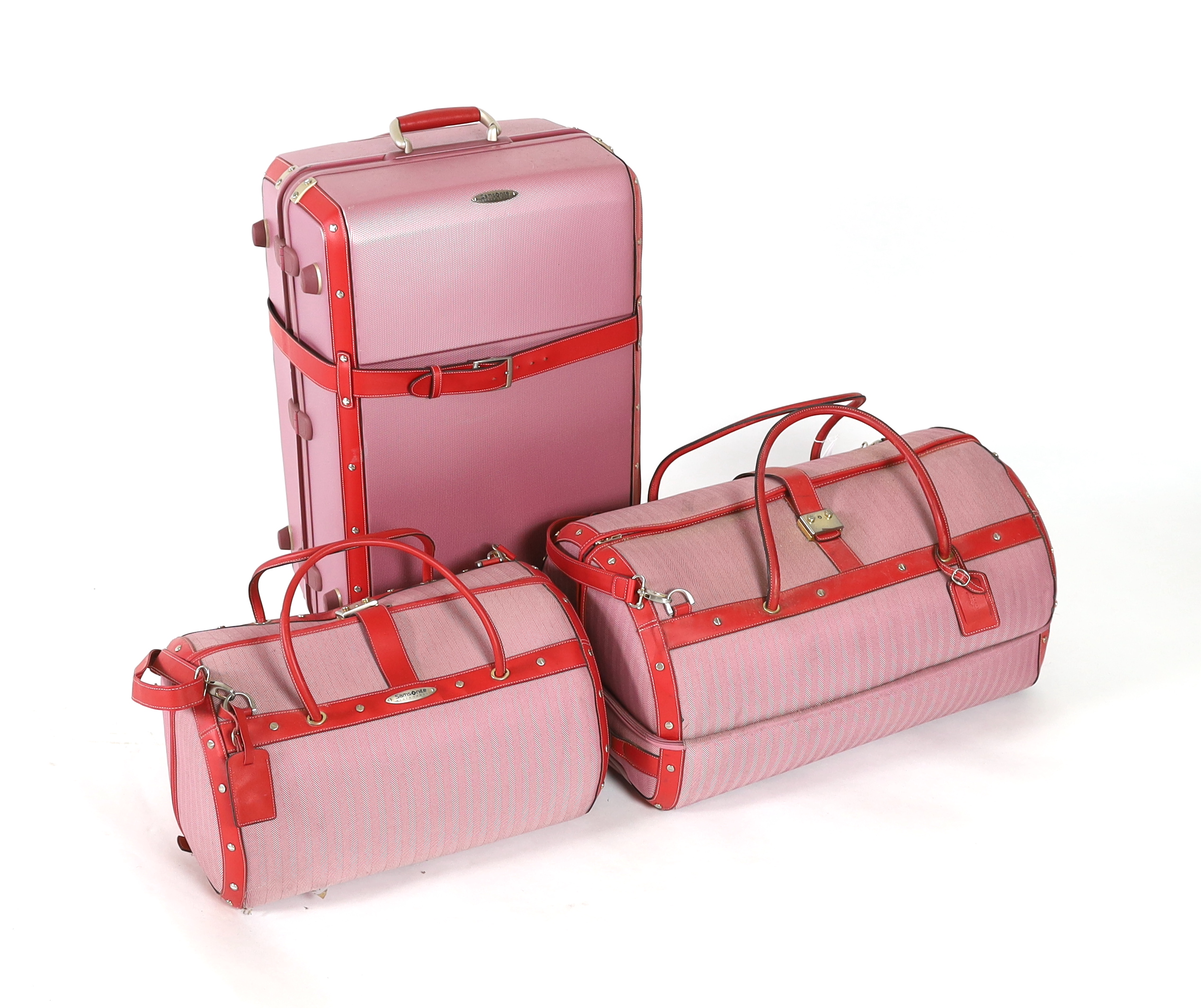 Three pink Samsonite Black Label luggage bags, Hard suitcase height 76cm, width 47cm, depth 31cm, Large holdall height 66cm x 39cm x 36cm, Smaller holdall height 51cm x 30cm x 36cm